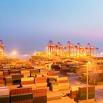 container wharf in nightfall, international import and export trade background