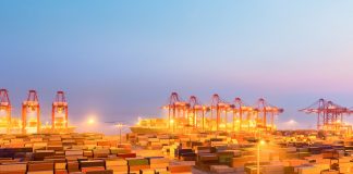 container wharf in nightfall, international import and export trade background