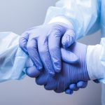 Doctors shake hands