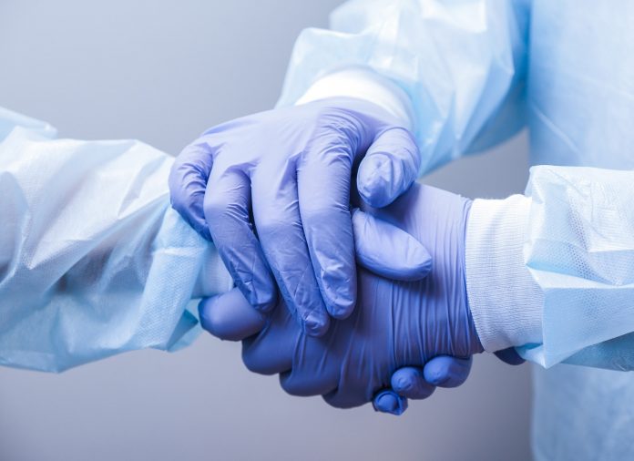 Doctors shake hands