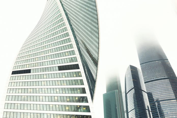 Glass facades of modern skyscrapers at business district