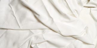 Textured white crumpled sheets