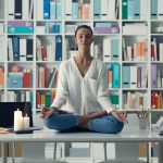 Woman practicing meditation on a desk